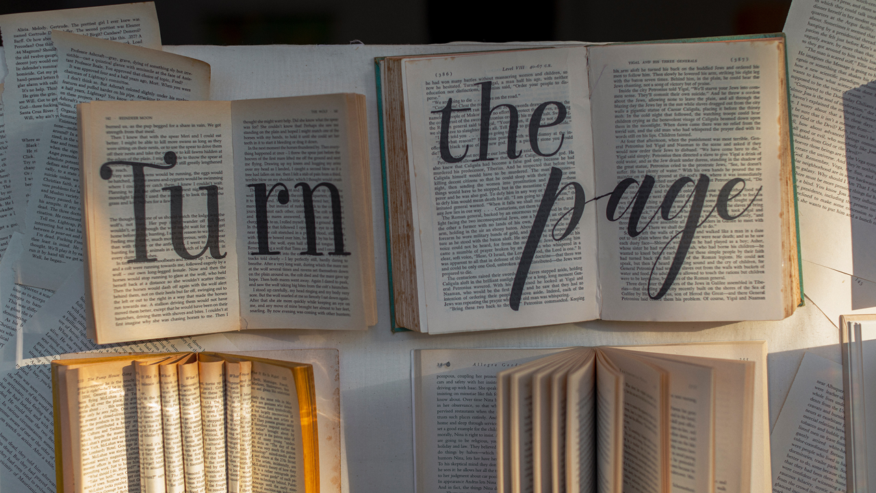 Two books side-by-side with "Turn the Page" written across them
