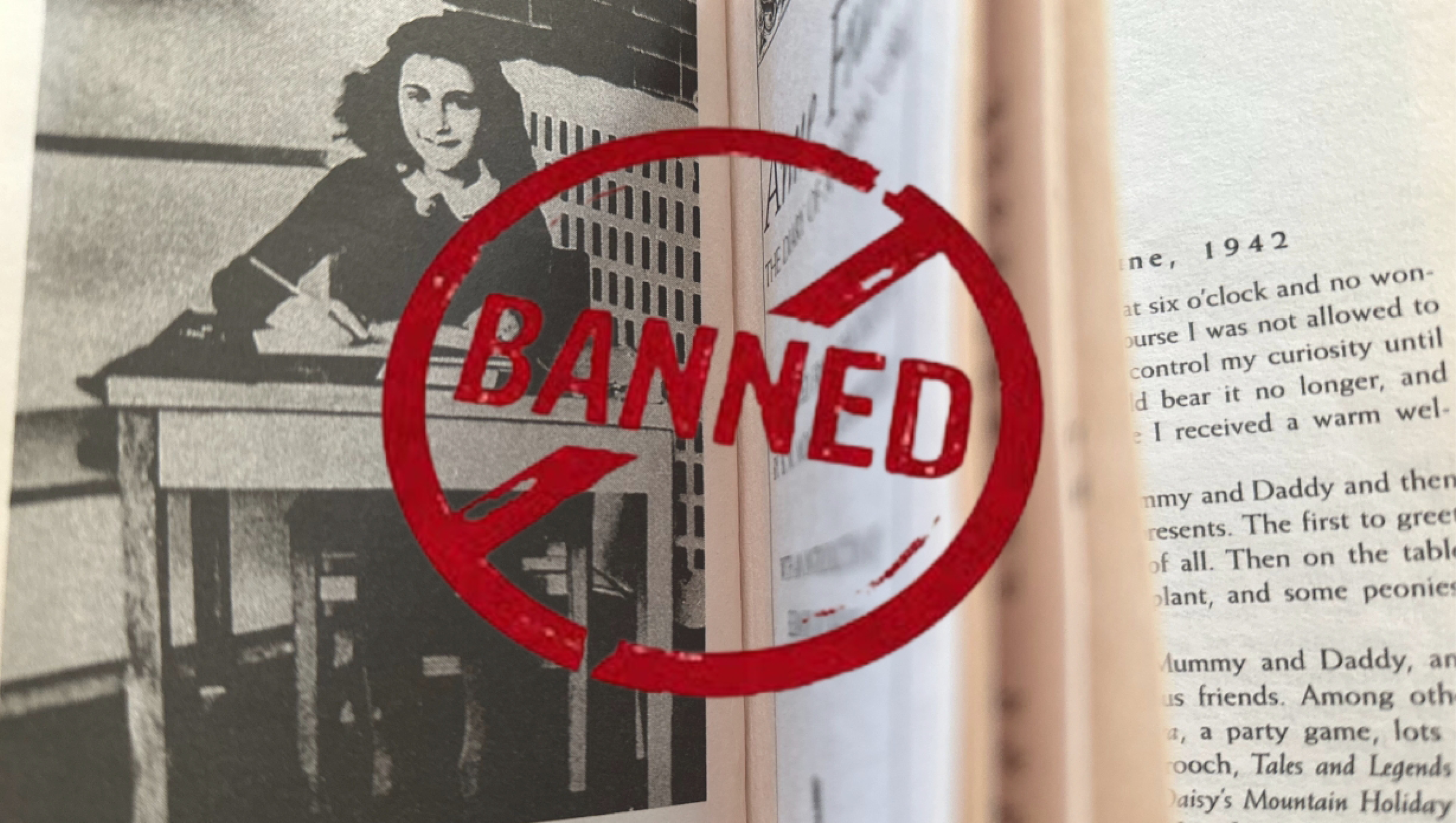 A photo of the book "The Diary of a Young Girl" by Anne Frank with a red stamp across it that reads "BANNED"