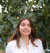 Anais Tisserand standing in front of a tree