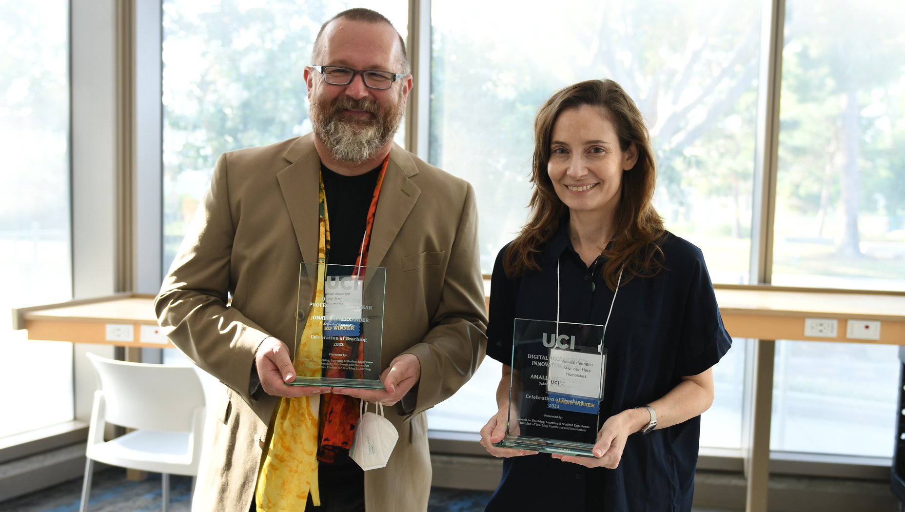 Photo of Jonathan Alexander and Amalia Herrmann with awards