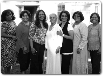 Professor Bambi Haggins standing with her sisters and mother