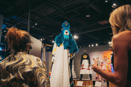 Visitors enjoying the Future Imaginaries: Indigenous Art, Fashion, Technology exhibit