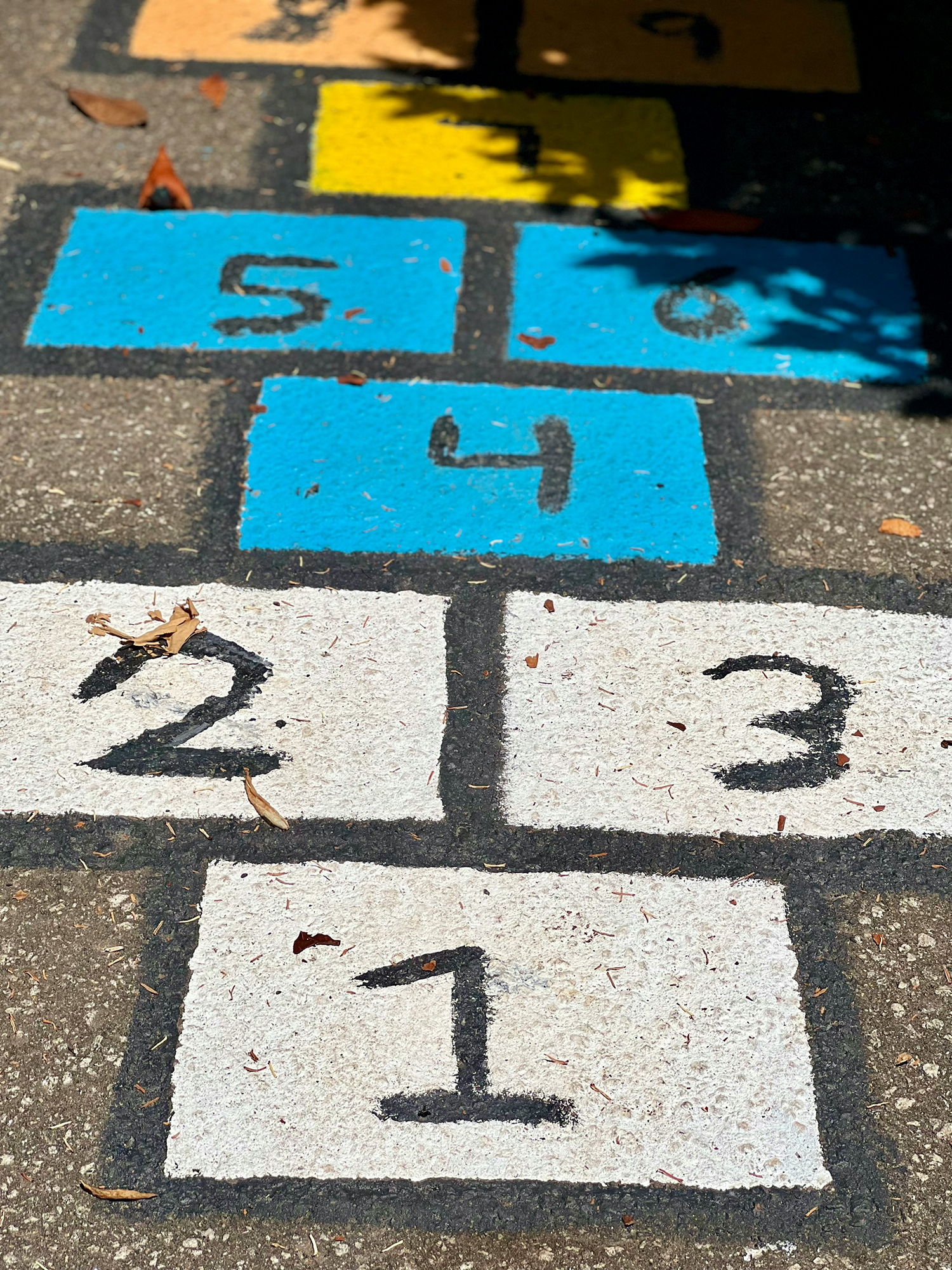 chalk blocks on sidewalk with numbers one through six