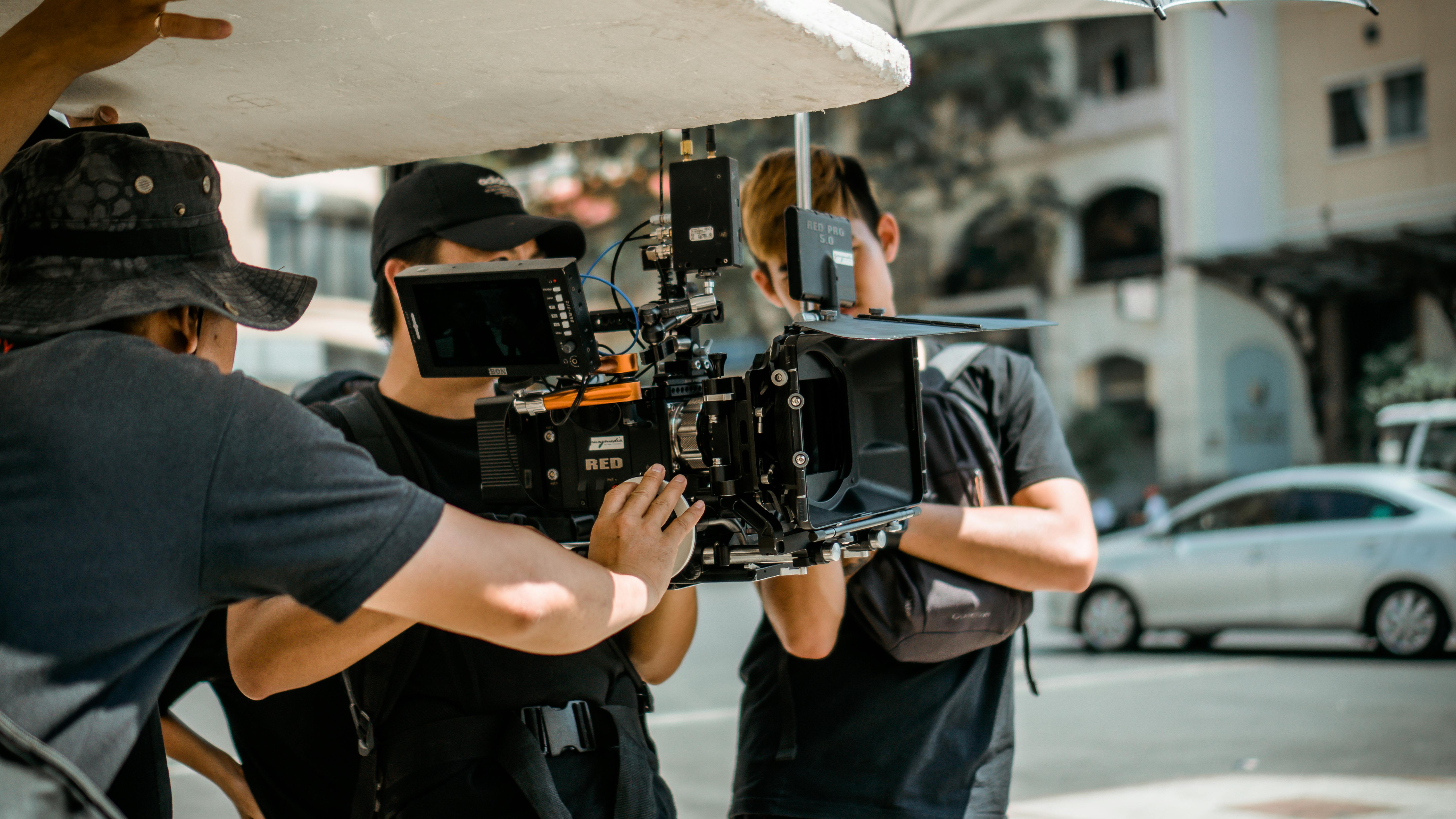 A crew of people using a camera