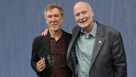 Professor Steintrager (left) and UCI Chancellor Howard Gillman (right) at the Academic Senate Awards ceremony