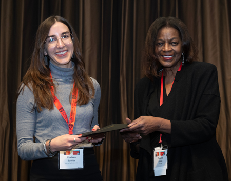 Chelsea Schields (left) accepting an award at the American Historical Association award ceremony alongside former AHA President Thavolia Glymph (right)