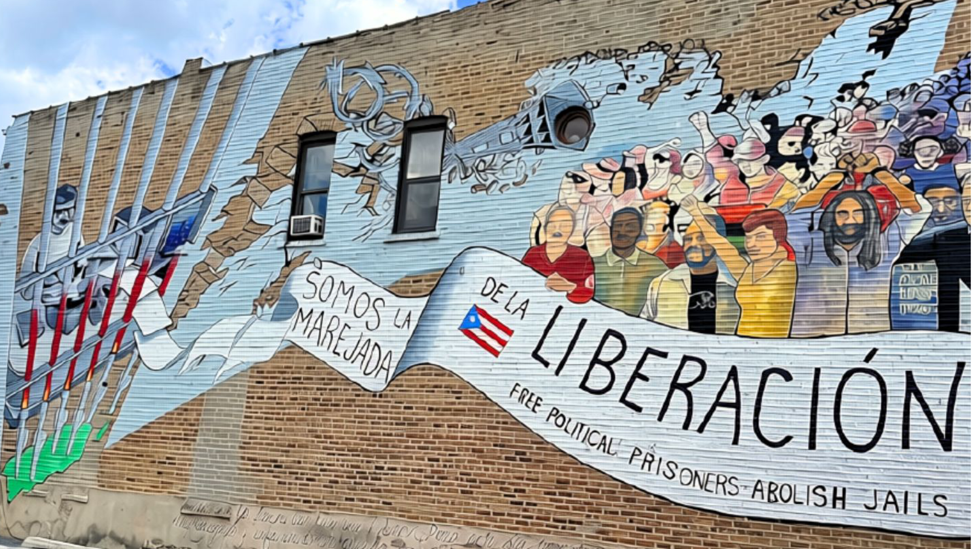 Mural painted on Division Street in the historic Paseo Boricua neighborhood of Humboldt Park, Chicago that reads "Oscar, somos la marejada de la liberación" ("Oscar, We Are the Groundswell of Liberation")