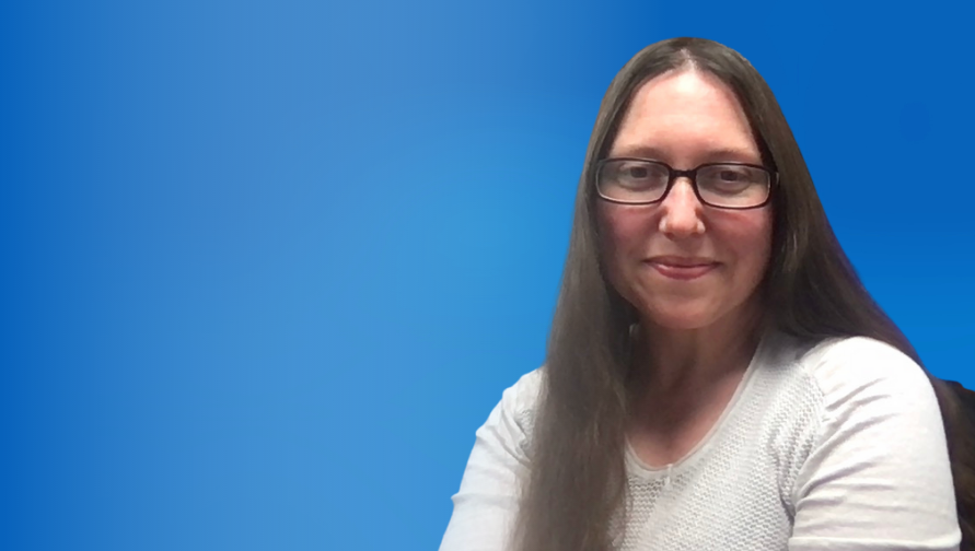 Rebecca Nykwest smiles against a blue background