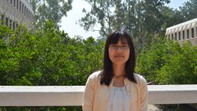 Ayuko Takeda standing with UCI in the background.
