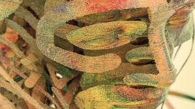 face shaped by water color swaths in brown