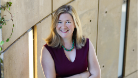 Bernadette Meyler headshot. She is standing with her arms crossed.