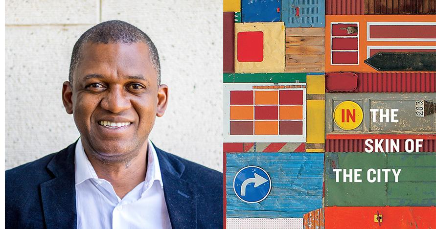 Head and shoulders of smiling man next to book cover