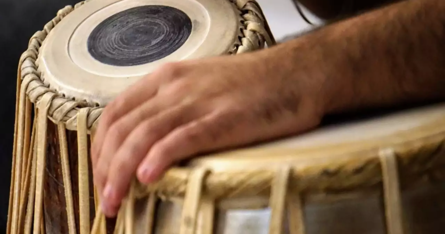 hand playing Indian instrument