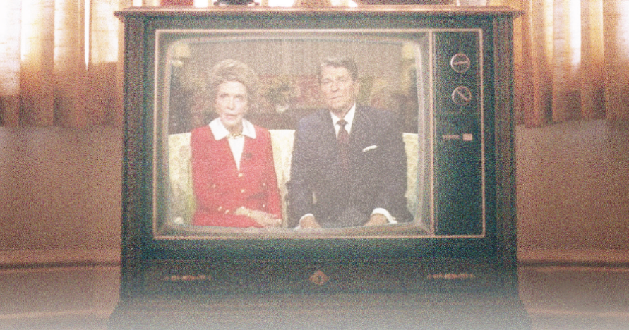 An image of a mid-century television showing an image of Nancy Reagan & Ronald Reagan sitting on a couch.