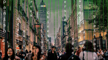 A photo of a city with green code over it and languages typed vertically to look like code.