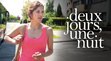 A woman wearing a pink tank top looks off to the side