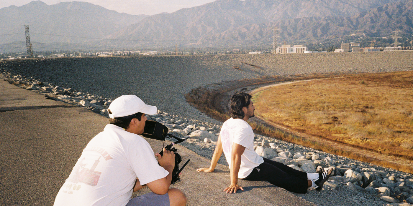 A behind the scenes image of The Pit, showing the DP and an actor. 