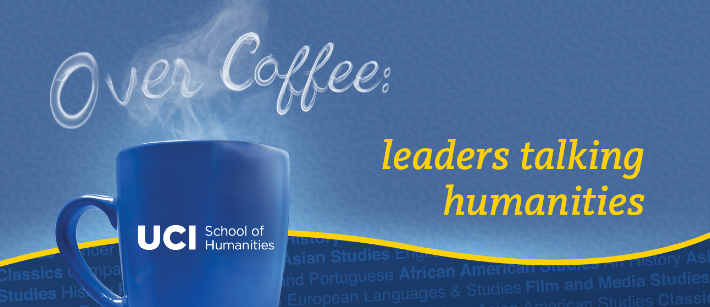 a blue UCI School of Humanities mug with "Over Coffee" written in steam