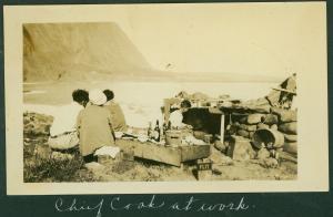 An old image in sepia tones of people cooking taken from the Molokai settlement
