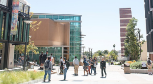 students walking across community college campus