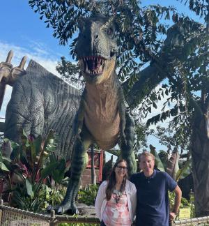 Duncan Pritchard standing in front of a T-rex