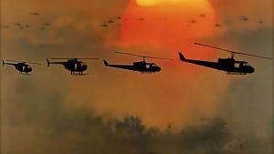 Four helicopters against an orange sky background from the movie Apocalypse Now