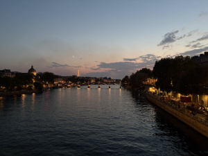The Seine River with buildings in the background on a clear night.