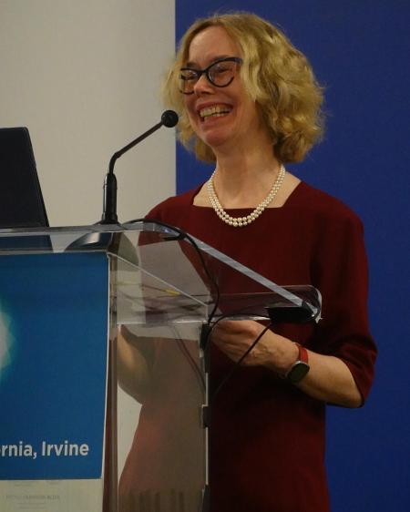 Julia Lupton standing at a podium