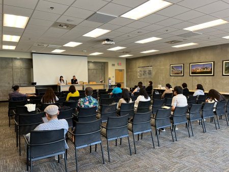 A presentation on new books with seated attendees and Christopher Hanscom and Blossom Jeong presenting