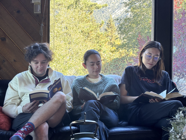 Speakers for talk sitting together and reading on a couch