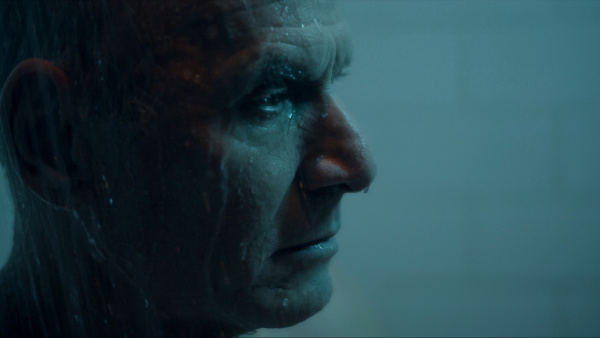 Profile of Man with Blue lighting and water dripping from his face