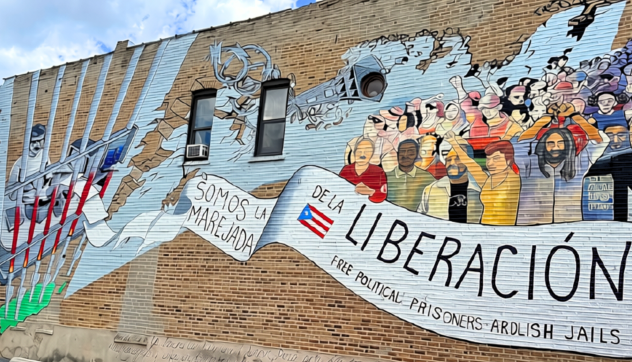 Mural painted on Division Street in the historic Paseo Boricua neighborhood of Humboldt Park, Chicago that reads "Oscar, somos la marejada de la liberación" ("Oscar, We Are the Groundswell of Liberation")