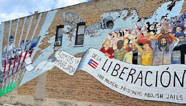 Mural painted on Division Street in the historic Paseo Boricua neighborhood of Humboldt Park, Chicago that reads "Oscar, somos la marejada de la liberación" ("Oscar, We Are the Groundswell of Liberation")