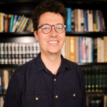 A headshot of Trevor Redd Smith