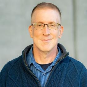 A headshot of Michael Szalay