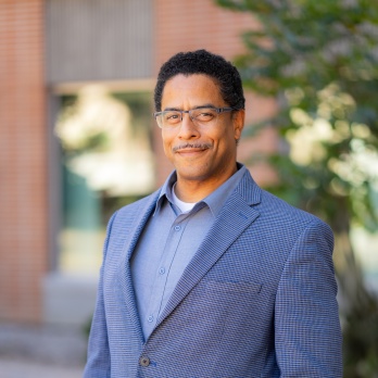 A photo of Assistant Dean, Tomas Figueroa, smiling.