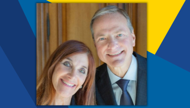 A close-up of Susan Samueli and Henry Samueli, who smile for the camera