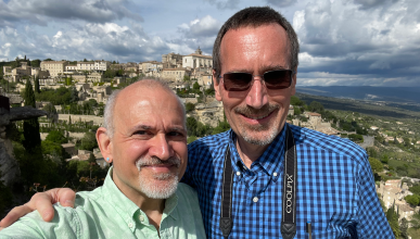 A photo of John Dumas (B.A. English ‘94) and UCI Professor James Nowick with a scenic background. 