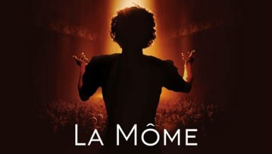 Woman's back singing to an audience