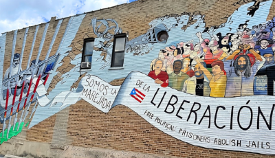Mural painted on Division Street in the historic Paseo Boricua neighborhood of Humboldt Park, Chicago that reads "Oscar, somos la marejada de la liberación" ("Oscar, We Are the Groundswell of Liberation")